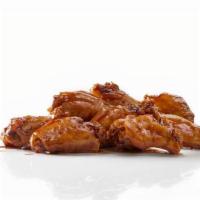 Bone In Smoked Wings · House Smoked Bone-In Wings with up to 2 flavors. Featured with our Honey Hot flavor.