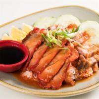 Kaw-Moo-Dang · Roast pork and crispy pork belly served over rice with five-spice peanut gravy, boiled egg, ...