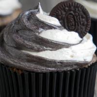 Oreo Cookies & Cream Cupcake · Vanilla cupcake mixed with Oreos, with vanilla cream cheese frosting mixed with crushed Oreo...