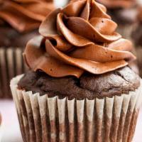 Triple Chocolate Cupcake · Classic chocolate cake topped with a milk chocolate buttercream frosting, and Hershey's cand...