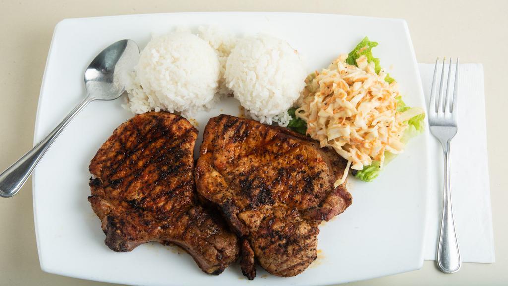 Grilled Pork Chops · Grilled pork chops smothered with sweet onions and johnny’s brown gravy.