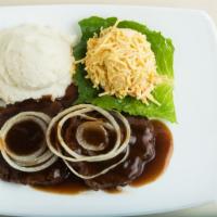 Hamburger Steak · Grilled hamburger steak smothered with sweet onions and Johnny’s brown gravy.