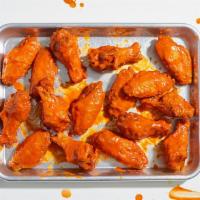 Bone-In Chicken Wings (18) · 18 bone-in chicken wings with your choice of sauce. Served with celery or carrots, and blue ...