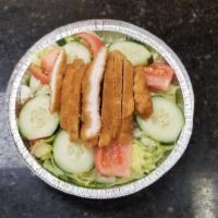 Grilled Chicken Salad · Grilled chicken topping a bed of romaine lettuce, tomatoes, cucumbers, onions, roasted red p...