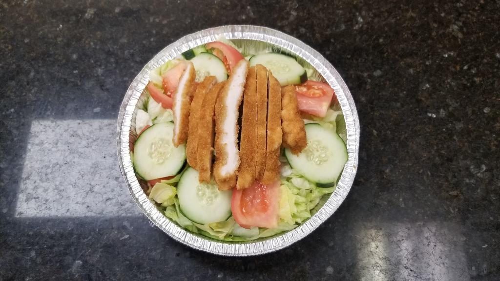 Grilled Chicken Salad · Grilled chicken topping a bed of romaine lettuce, tomatoes, cucumbers, onions, roasted red peppers, olives, and croutons.