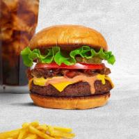 Classic Feast Burger · Seasoned half-pound American beef patty perfectly cooked to medium on a griddled bun. Served...