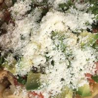 Chicken Taco Salad · lettuce tomatoes onion, cilantro, avocado, cotija cheese crispy flour.