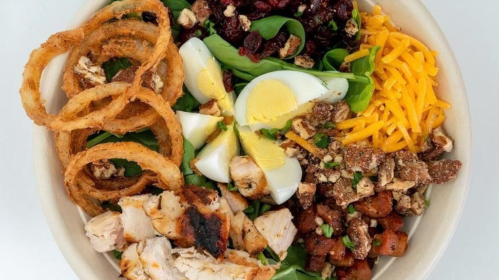 Spinach Bacon Salad · organic baby spinach, braised bacon, hard boiled eggs, shredded cheddar, frizzled onions, balsamic vinaigrette