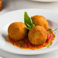 Arancini · Fried risotto balls, fresh mozzarella, fresh tomato sauce.