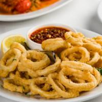 Calamari · Fried calamari and marinara dipping sauce.  .