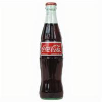 Mexican Coca Cola · Imported, made with real cane sugar. 12oz Glass Bottle