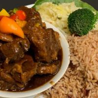 Medium Ox Tail Dinner · Served with your choice of the following: Rice and Peas, and steamed vegetables
