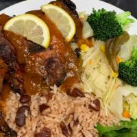 Medium Jerk Chicken Dinner · Served with your choice of the following: Rice and Peas and steamed vegetables