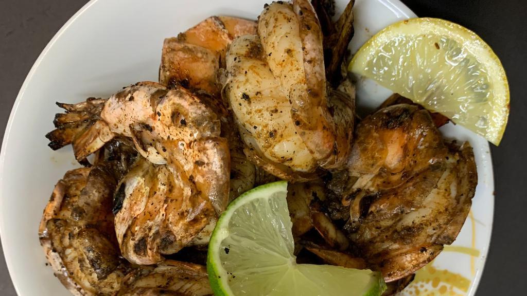 12 Jerk Jumbo Shrimp Dinner   · Served with your choice of the following: Rice and Peas and steamed vegetables