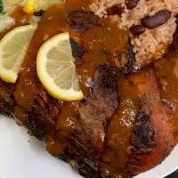  Medium Jerk Chicken Dinner · SERVE WITH RICE AND BEANS AND STEAMED VEGETABLE  
JERK SAUCE OR  BBQ SAUCE