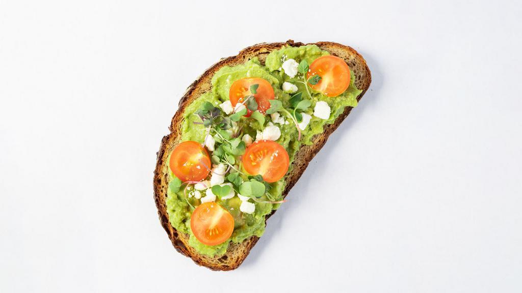 Avocado Toast · Avocado, feta, tomatoes, and microgreens on toasted Multigrain batard toast.
