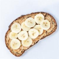 Almond Butter Toast (Vegan) · Almond butter, bananas, and honey on toasted Multigrain batard toast.