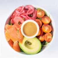 Salmon And Avocado Salad · Arugula, salmon, avocado, tomatoes, capers, pickled radishes and onions, and Sesame ginger d...