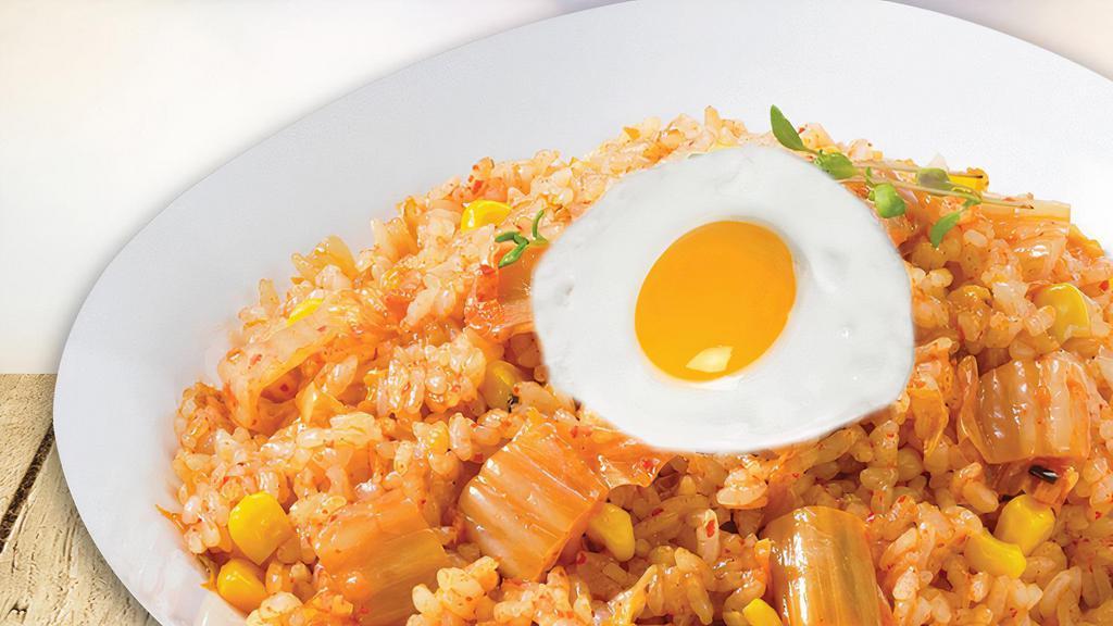 Kimchi Fried Rice
 · Stir fried rice with vegetables and  kimchi base.