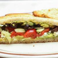 Greek Avocado Toast · Crumbled feta, mashed avocado, cherry tomatoes, chopped cucumbers, chopped Kalamata olives, ...