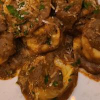 Beef Cheek Ravioli  · With crushed squab liver and black truffles.