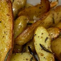 Roasted Potatoes · With rosemary.