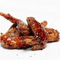 Chicken Wings And Drumsticks · 3 pc chicken wings and 3 pc drumsticks, marinated with teriyaki sauce, topped with black pep...