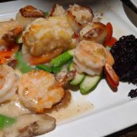 King Of The Sea · Jumbo shrimp, scallops & lobster, Thai brown rice w. lemon butter sauce.
