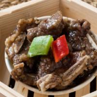 Beef Short Ribs W. Black Pepper Sauce 黑椒牛仔骨 · Steamed beef short ribs w. black pepper sauce