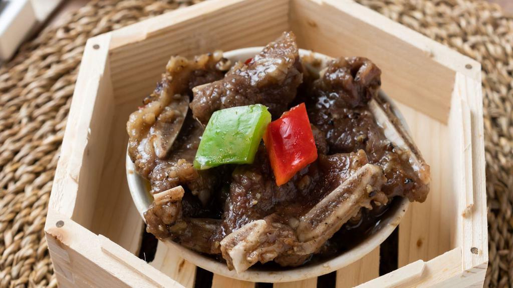 Beef Short Ribs W. Black Pepper Sauce 黑椒牛仔骨 · Steamed beef short ribs w. black pepper sauce