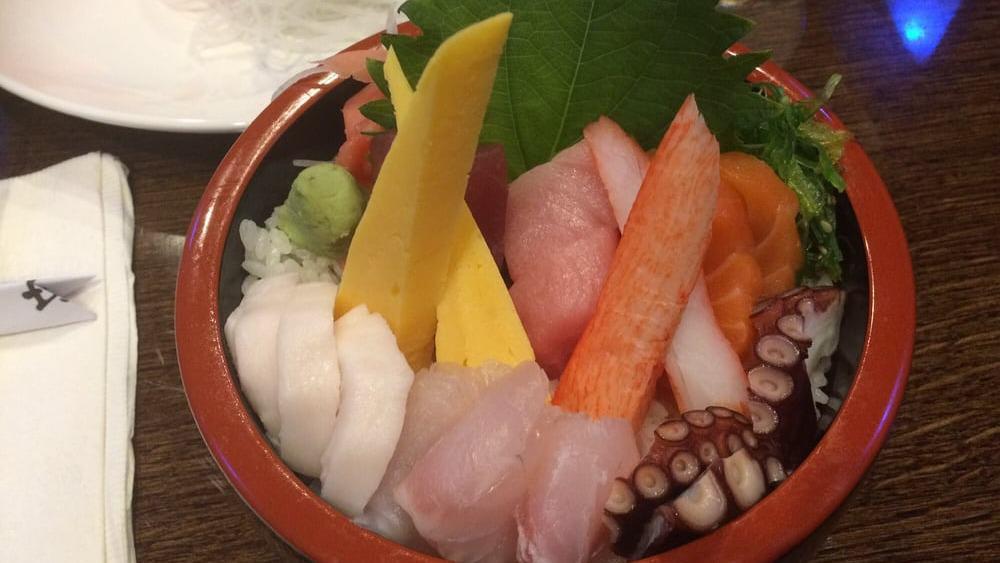 Chirashi · Assorted sashimi and vegetables over sushi rice.