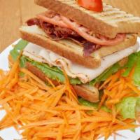 Turkey Triple Decker · Boar's head turkey, beef bacon, lettuce and tomatoes.