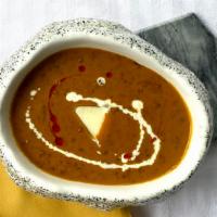 Daal Makhani · Black lentils, churned butter, and MMD signature.
