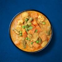 Veggie Korma Delight · Mixed vegetables simmered in rich, flavorful coconut curry with whole Indian spices. Served ...