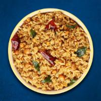 Tangy Tamarind Rice  · Our long grain aromatic basmati rice, steamed to perfection and tempered with our house spec...
