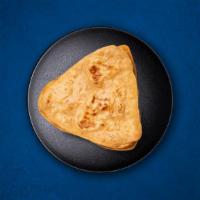 Plain Paratha · Whole wheat flaky bread baked over a flat griddle.
