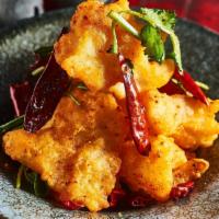 Sichuan Storm Fish · Spicy. Crispy fluke filet, cilantro, scallion, and Sichuan peppercorn.