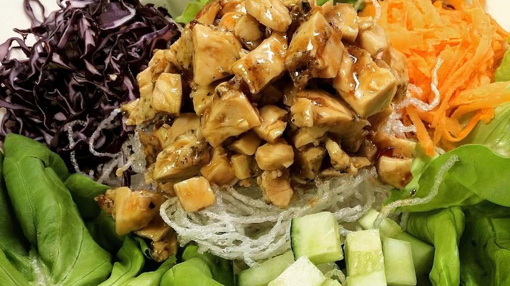 Asian Lettuce Wraps · Marinated grilled chicken breast, red cabbage, cucumber, carrots, cilantro, rice noodles, spicy peanut sauce.