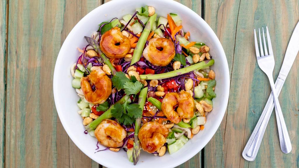 Udon Noodle Salad · Udon noodles mixed with a spicy peanut sauce, asparagus, shredded carrots, red cabbage, sauteed teriyaki shrimp, cucumber, sesame seeds, honey roasted peanuts, red pepper, cilantro