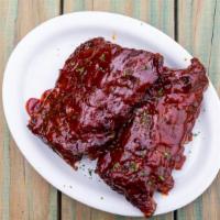 Bbq Ribs Full Rack · Slow cooked, tender baby back ribs, in our southern BBQ sauce. Choice of side.