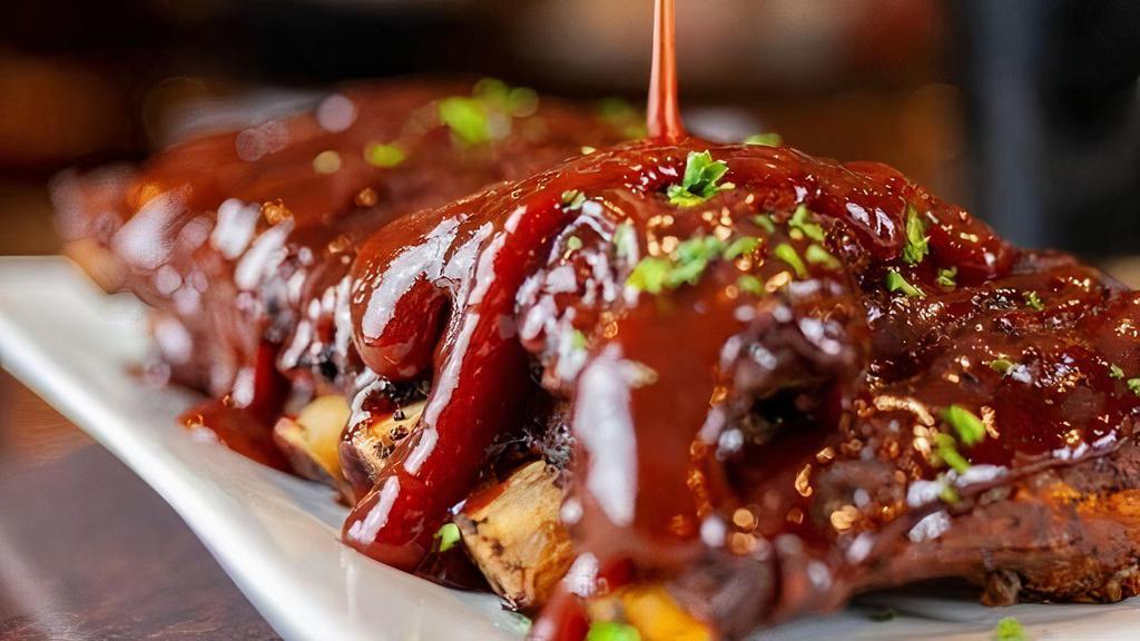 Bbq Ribs Half Rack · Slow cooked, tender baby back ribs, in our southern BBQ sauce. Choice of side.