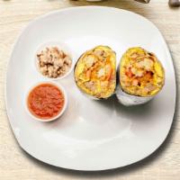 Sauced Up Sausage Breakfast Burrito · Sausage, tater tots, egg, and  cheddar cheese, tomatoes and caramelized onions wrapped in a ...