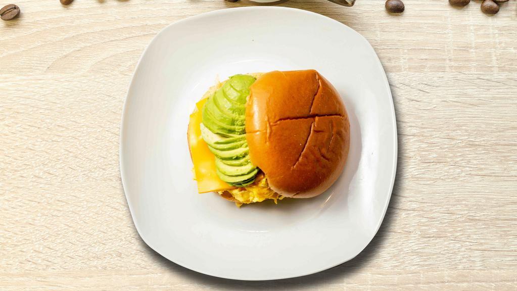 Avocado, Egg And Cheese Sandwich · Avocado, scrambled egg, cheddar cheese, sliced tomato and caramelized onions.