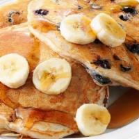 Banana Berry Pancakes · Fluffy banana and berries pancakes cooked with care and love served with butter and maple sy...