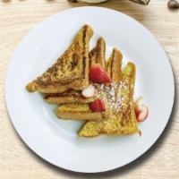 French Toast · Fresh bread battered in egg, milk, and cinnamon cooked until spongy and golden brown. Served...