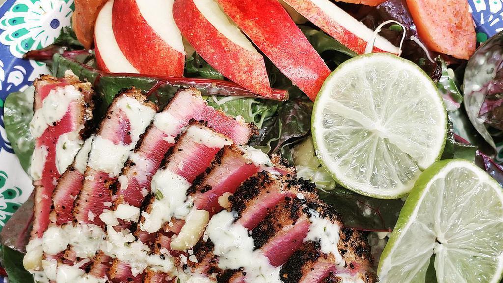 Seared Ahi Salad · Wasabi lime crema dressing w/ perfectly seared ahi from our local hawaiian waters . Its mouthwatering and cooked to perfection.