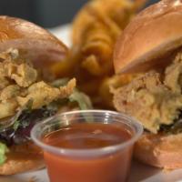 Buffalo Chicken Sliders · Crispy fried chicken, with coleslaw, on guava buns all with our House-made buffalo ranch sau...