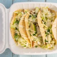 Grilled Fresh Fish Tacos (3) · Freshly caught fish, grilled and served with our house stone-ground tortillas, Cilantro, cre...