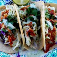 Beer Battered Fish Tacos (3) · Beer Battered fresh fish, pineapple coleslaw, House tortillas and sauced with our signature ...