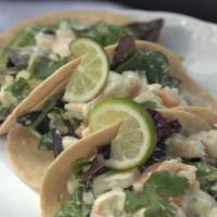 Garlic Shrimp Tacos (3 Pack) · Fresh garlic and shrimp sautéed and placed in our house homemade style tortillas. This item ...